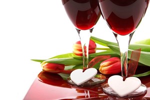 red_and_yellow_anniversary_tulips_with_two_glasses_of_red_wine